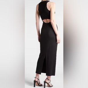 A long black maxi dress opening in the low back area
